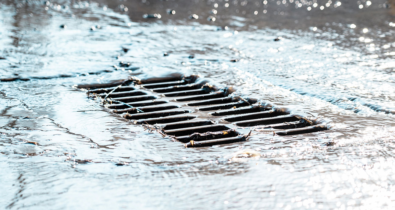 rain water flowing into storm drain