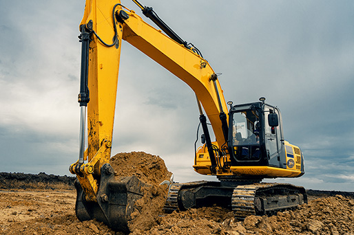 Mike Mann Construction Excavator clearing field